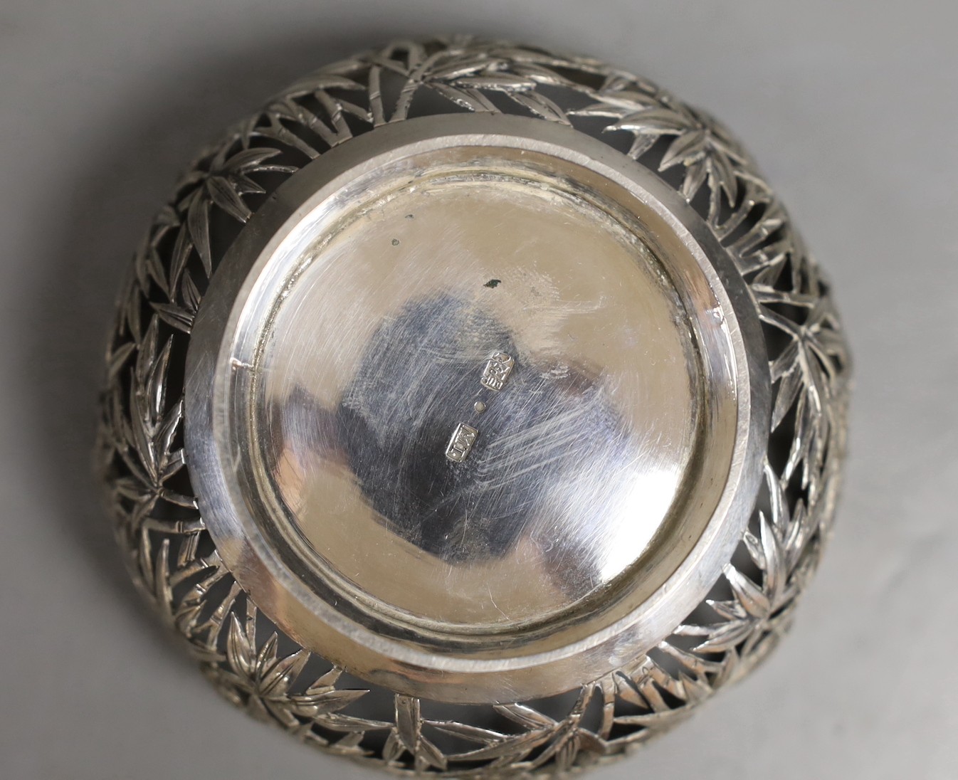 An early 20th century Chinese Export pierced white metal bowl, maker TW, diameter 92mm, 96 grams.